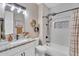 Charming bathroom with white subway tile, granite counter, and modern black hardware at 21266 S 213Th Pl, Queen Creek, AZ 85142