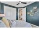 Cozy bedroom with dark green walls, closet with white doors and view to the bathroom at 21266 S 213Th Pl, Queen Creek, AZ 85142