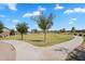 Inviting community park with open green space and paved walking paths at 21266 S 213Th Pl, Queen Creek, AZ 85142