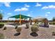 Well-maintained community park featuring a playground and covered picnic area at 21266 S 213Th Pl, Queen Creek, AZ 85142
