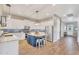 Open kitchen featuring a blue island, white cabinets, and stainless steel appliances at 21266 S 213Th Pl, Queen Creek, AZ 85142