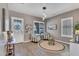 Comfortable living room with striped chairs, natural light, and stylish decor at 21266 S 213Th Pl, Queen Creek, AZ 85142