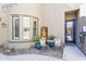 Cozy outdoor patio featuring comfortable seating and a decorative fountain at 21266 S 213Th Pl, Queen Creek, AZ 85142