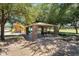 Shaded picnic area with stone columns, seating, and a grill, perfect for outdoor gatherings at 21266 S 213Th Pl, Queen Creek, AZ 85142