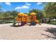 Colorful playground with multiple play structures and a covered picnic area nearby at 21266 S 213Th Pl, Queen Creek, AZ 85142