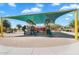 Large covered playground with slides, climbing structures, and a sandbox area at 21266 S 213Th Pl, Queen Creek, AZ 85142