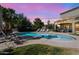 Inviting pool with lounge chairs and beautiful sunset lighting, perfect for relaxing evenings at 21266 S 213Th Pl, Queen Creek, AZ 85142