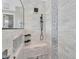 Modern shower with white subway tile, black hardware, and gray mosaic accent tile at 21266 S 213Th Pl, Queen Creek, AZ 85142