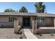 Inviting home exterior showcasing a tidy yard and a welcoming entrance with a double door at 2156 E Cairo Dr, Tempe, AZ 85282
