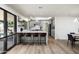 Modern kitchen with a breakfast bar, sleek cabinetry, and an open design with a view at 2156 E Cairo Dr, Tempe, AZ 85282