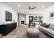 Modern living room with fireplace, sleek furniture, and stylish decor accents at 2156 E Cairo Dr, Tempe, AZ 85282