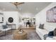 Open-concept living area with light wood floors, seamless flow, and access to outdoor spaces at 2156 E Cairo Dr, Tempe, AZ 85282