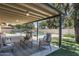 Relaxing covered patio featuring outdoor seating with a view of the backyard and pool at 2156 E Cairo Dr, Tempe, AZ 85282