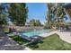 Backyard pool area with well-maintained landscaping, turf, and privacy wall at 2156 E Cairo Dr, Tempe, AZ 85282