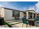 Backyard offers a grill area and comfortable seating around fire pit at 23503 S 228Th Pl, Queen Creek, AZ 85142
