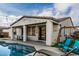 The backyard offers a pool and a patio with outdoor seating at 23503 S 228Th Pl, Queen Creek, AZ 85142