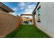 Grassy backyard featuring a swing set, perfect for Gathering fun and outdoor activities at 23503 S 228Th Pl, Queen Creek, AZ 85142