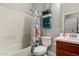 Bathroom with a white toilet and bathtub with shower at 23503 S 228Th Pl, Queen Creek, AZ 85142