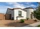 Charming single-story home featuring a unique turret entry, tile roof, and desert landscaping at 23503 S 228Th Pl, Queen Creek, AZ 85142