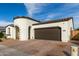Charming single-story home featuring a unique turret entry, tile roof, and two-car garage at 23503 S 228Th Pl, Queen Creek, AZ 85142