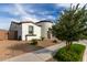 Charming single-story home featuring a unique turret entry, tile roof, and desert landscaping at 23503 S 228Th Pl, Queen Creek, AZ 85142