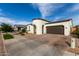 Charming single-story home featuring a unique turret entry, tile roof, and two-car garage at 23503 S 228Th Pl, Queen Creek, AZ 85142