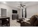 Spacious living room with a ceiling fan and tile flooring at 23503 S 228Th Pl, Queen Creek, AZ 85142