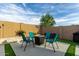 Backyard patio area with modern outdoor seating around a fire pit, creating a relaxing space at 23503 S 228Th Pl, Queen Creek, AZ 85142