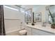 Bright bathroom features a soaking tub, sleek vanity, and modern fixtures at 24645 N 164Th Dr, Surprise, AZ 85387