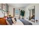 Cozy bedroom with a plaid accent wall, rustic decor, and a comfortable bed with decorative pillows at 24645 N 164Th Dr, Surprise, AZ 85387