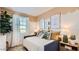 Charming bedroom with decorative paint, comfy daybed, and a cozy reading nook with plenty of natural light at 24645 N 164Th Dr, Surprise, AZ 85387