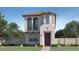 Charming two-story home showcasing a tile roof, trimmed windows, and a quaint, manicured lawn at 24645 N 164Th Dr, Surprise, AZ 85387