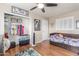 Charming bedroom with a built-in bed frame, hardwood floors, and ample closet space at 2508 N Karen Dr, Chandler, AZ 85224