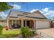 Charming single-Gathering home with solar panels, a covered porch, and a well-maintained lawn at 2508 N Karen Dr, Chandler, AZ 85224