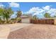 Spacious property with a long driveway, RV gate, and a two-car garage, perfect for outdoor living at 2508 N Karen Dr, Chandler, AZ 85224