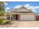 Charming single-Gathering home featuring a well-manicured lawn, solar panels, and a two-car garage at 2508 N Karen Dr, Chandler, AZ 85224