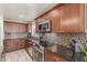Well-equipped kitchen with granite countertops, stainless steel appliances, and ample cabinet space at 2508 N Karen Dr, Chandler, AZ 85224