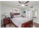 Serene bedroom with a large bed, ceiling fan, and view to the bathroom for a calming retreat at 2508 N Karen Dr, Chandler, AZ 85224