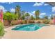Refreshing pool area with red umbrellas, and lush landscaping for outdoor enjoyment at 2508 N Karen Dr, Chandler, AZ 85224