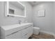 Modern bathroom with sleek vanity, updated fixtures, and light-up mirror at 26 W Morten Ave, Phoenix, AZ 85021