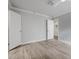 Bright bedroom features light gray walls and beautiful wood-look flooring at 26 W Morten Ave, Phoenix, AZ 85021