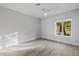 Bedroom with bright window and beautiful wood-look flooring at 26 W Morten Ave, Phoenix, AZ 85021