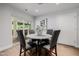 Cozy dining area with modern furniture, wood floors, and natural light, perfect for intimate meals and gatherings at 26 W Morten Ave, Phoenix, AZ 85021