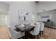 Elegant dining room with stylish furnishings, modern lighting, and artwork at 26 W Morten Ave, Phoenix, AZ 85021