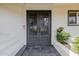 Close up image of the geometric metal front doors and white exterior at 26 W Morten Ave, Phoenix, AZ 85021