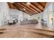 Open living room boasts a wood ceiling, fireplace, and seamless indoor-outdoor flow at 26 W Morten Ave, Phoenix, AZ 85021