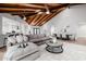 Expansive living area features a beamed ceiling, stylish furniture, and open layout at 26 W Morten Ave, Phoenix, AZ 85021