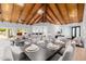 Bright living area boasts wood ceilings, modern decor, and seamless indoor-outdoor flow, perfect for entertaining at 26 W Morten Ave, Phoenix, AZ 85021