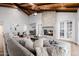 Spacious living room with a stone fireplace, comfortable seating, and dining area at 26 W Morten Ave, Phoenix, AZ 85021