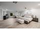 Spacious main bedroom featuring wood-look floors, sitting area, and access to the backyard at 26 W Morten Ave, Phoenix, AZ 85021